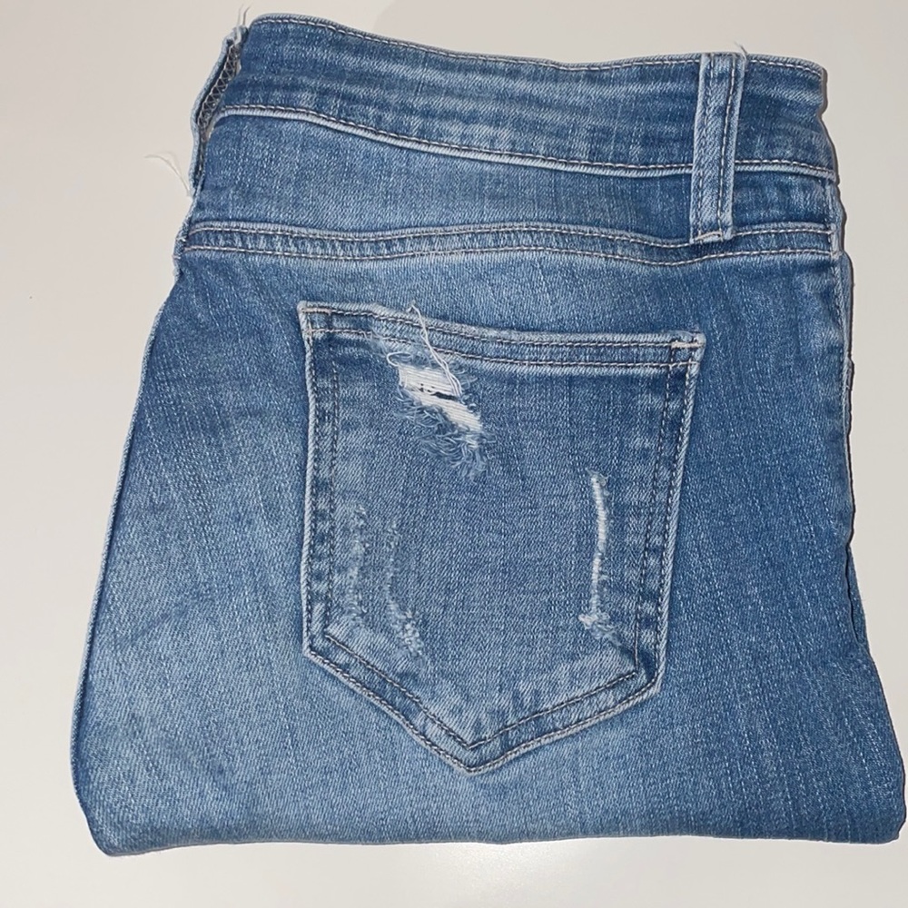 ripped blue Jeans